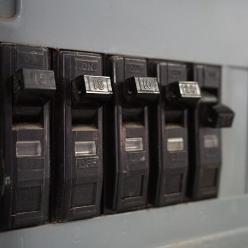 breaker switches close up at electrical panel houston tx